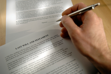 A person is writing on the page of an article.