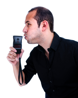 A man holding up his cell phone to the side of his face.