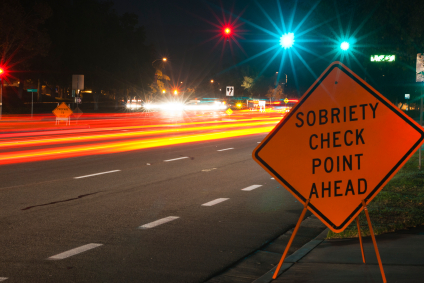 A sign warning drivers to check their speed ahead.
