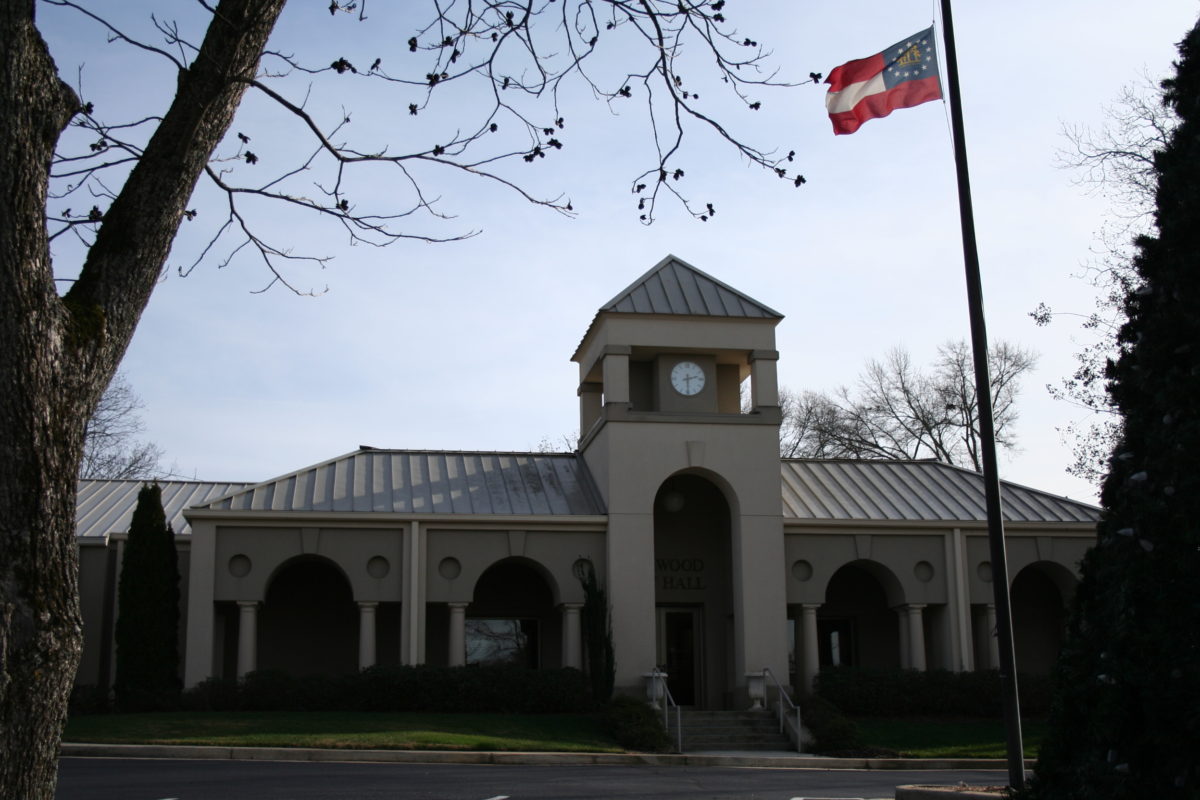 Town hall with clock tower and flag