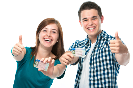 A man and woman holding up their id cards.